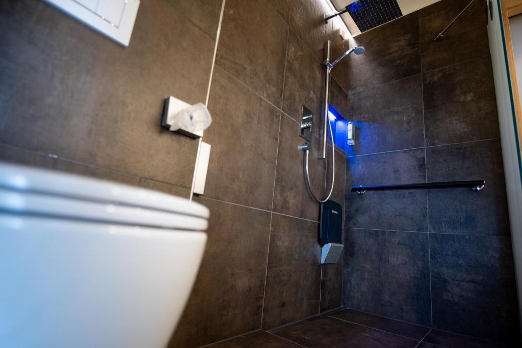 Koupelna v ubytování Hotel Pinei