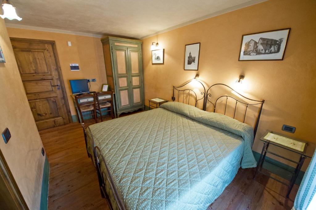 Postel nebo postele na pokoji v ubytování La Maison Des Vignerons Chambres D'Hotes B&B