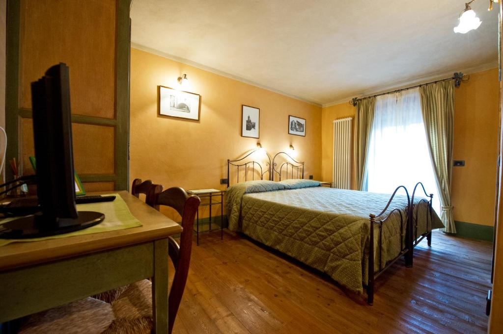 Postel nebo postele na pokoji v ubytování La Maison Des Vignerons Chambres D'Hotes B&B