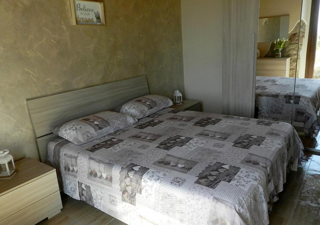 Postel nebo postele na pokoji v ubytování B&B GLI ULIVI