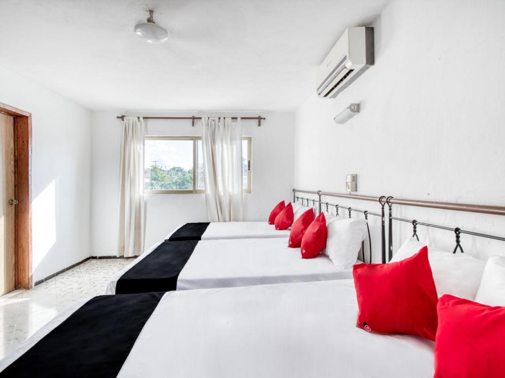 Postel nebo postele na pokoji v ubytování Hotel San Carlos