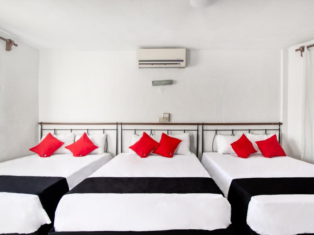 Postel nebo postele na pokoji v ubytování Hotel San Carlos