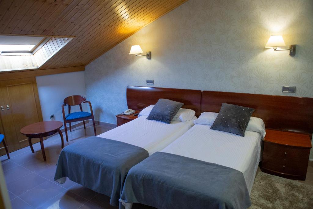 Postel nebo postele na pokoji v ubytování Hotel Las Moradas