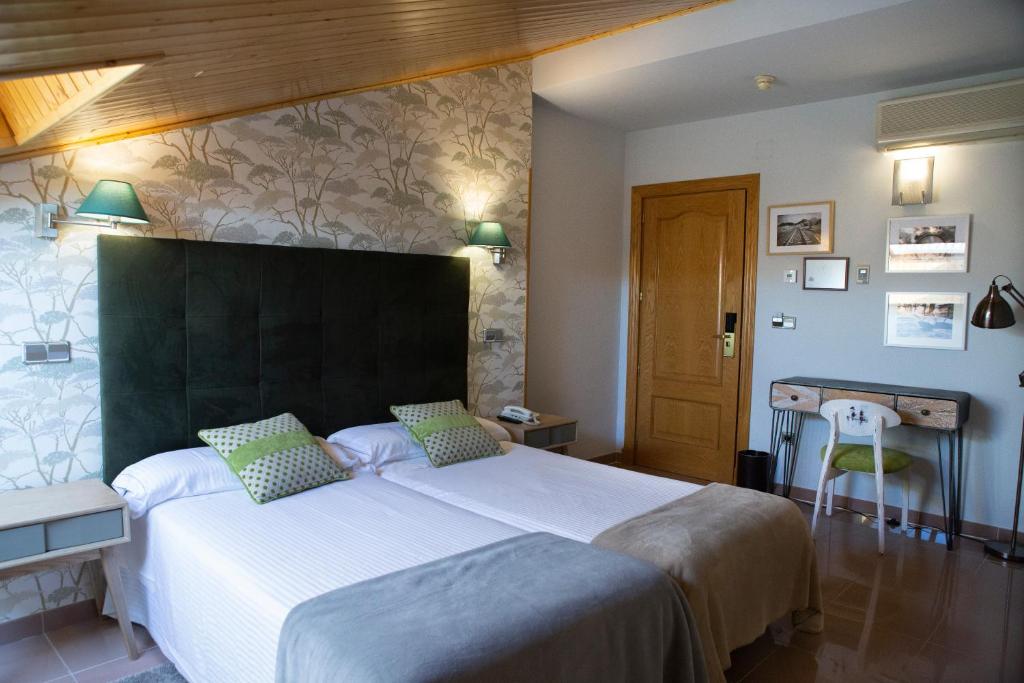 Postel nebo postele na pokoji v ubytování Hotel Las Moradas