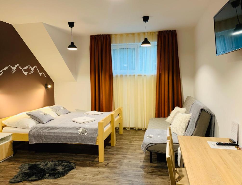 Postel nebo postele na pokoji v ubytování Stodola na Bílé