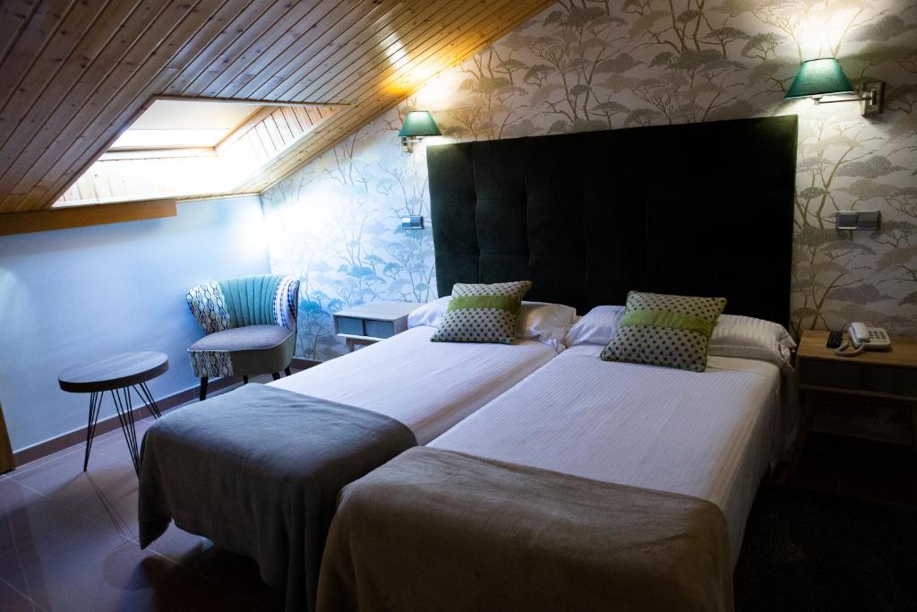 Postel nebo postele na pokoji v ubytování Hotel Las Moradas