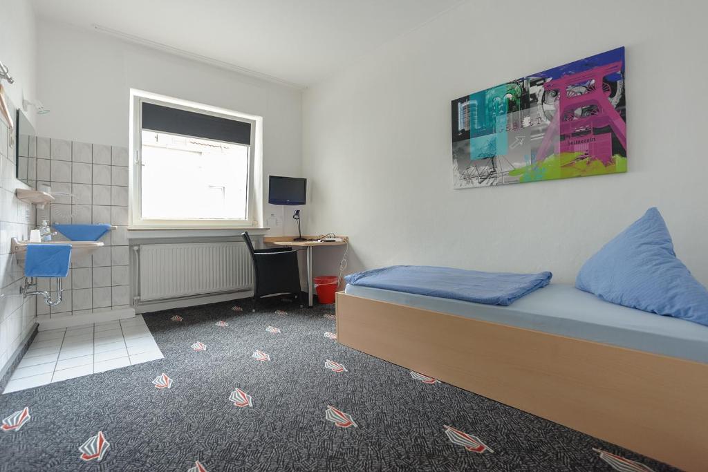 Uma cama ou camas num quarto em Boardinghouse Gladbeck