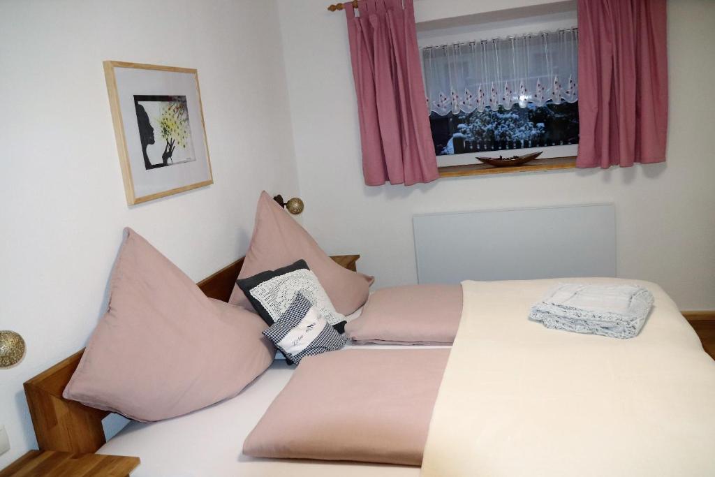 Postel nebo postele na pokoji v ubytování Haus Neuwirt
