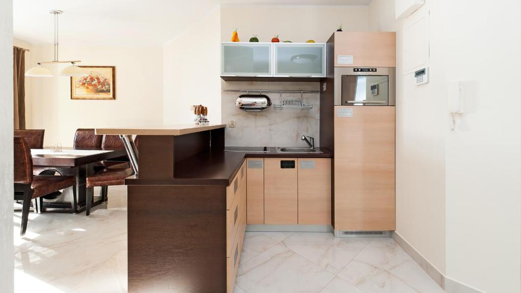 Kuchyňa alebo kuchynka v ubytovaní Apartamenty Sun & Snow Kościelisko Czajki