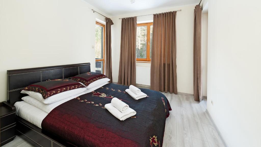 Posteľ alebo postele v izbe v ubytovaní Apartamenty Sun & Snow Kościelisko Czajki
