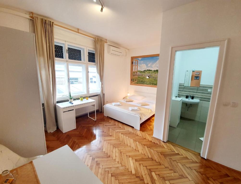 Postel nebo postele na pokoji v ubytování B&B Vila Teslova