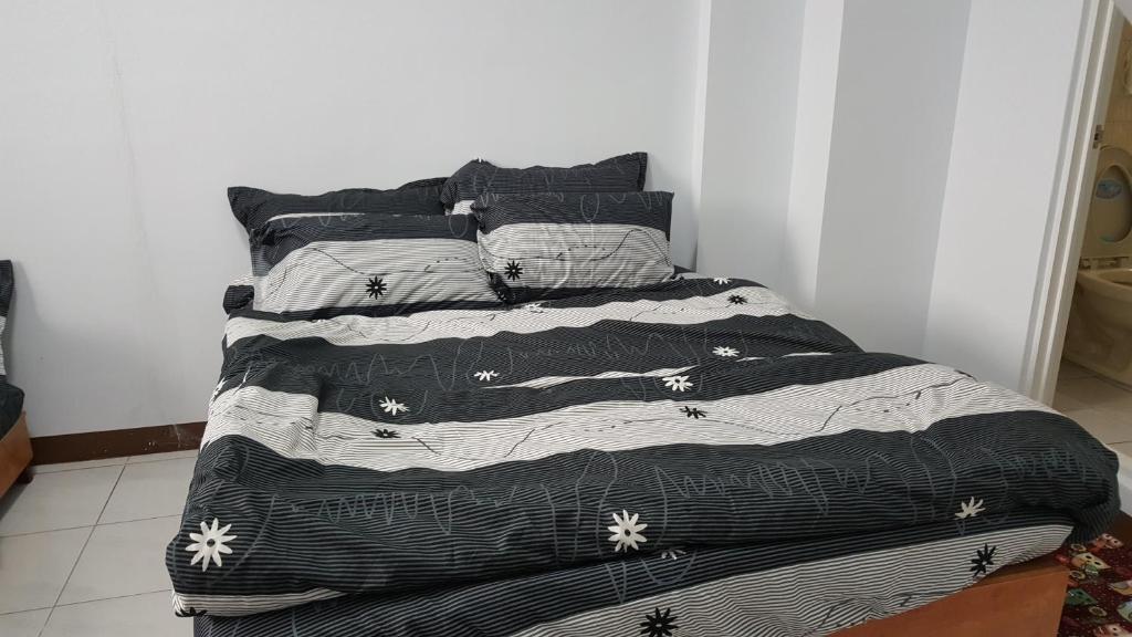 Postel nebo postele na pokoji v ubytování 枋寮小象民宿