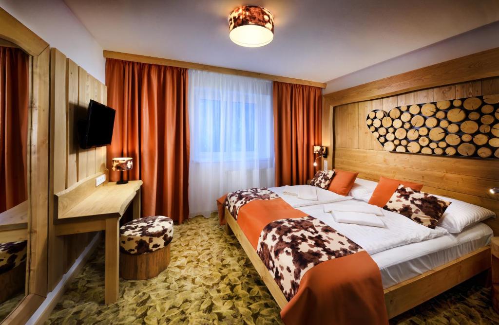 Postel nebo postele na pokoji v ubytování Hotel Srdiečko