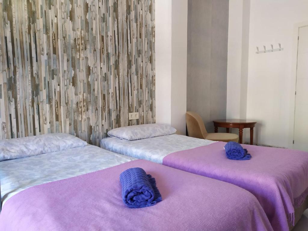 Posteľ alebo postele v izbe v ubytovaní Málaga Centro Hostel