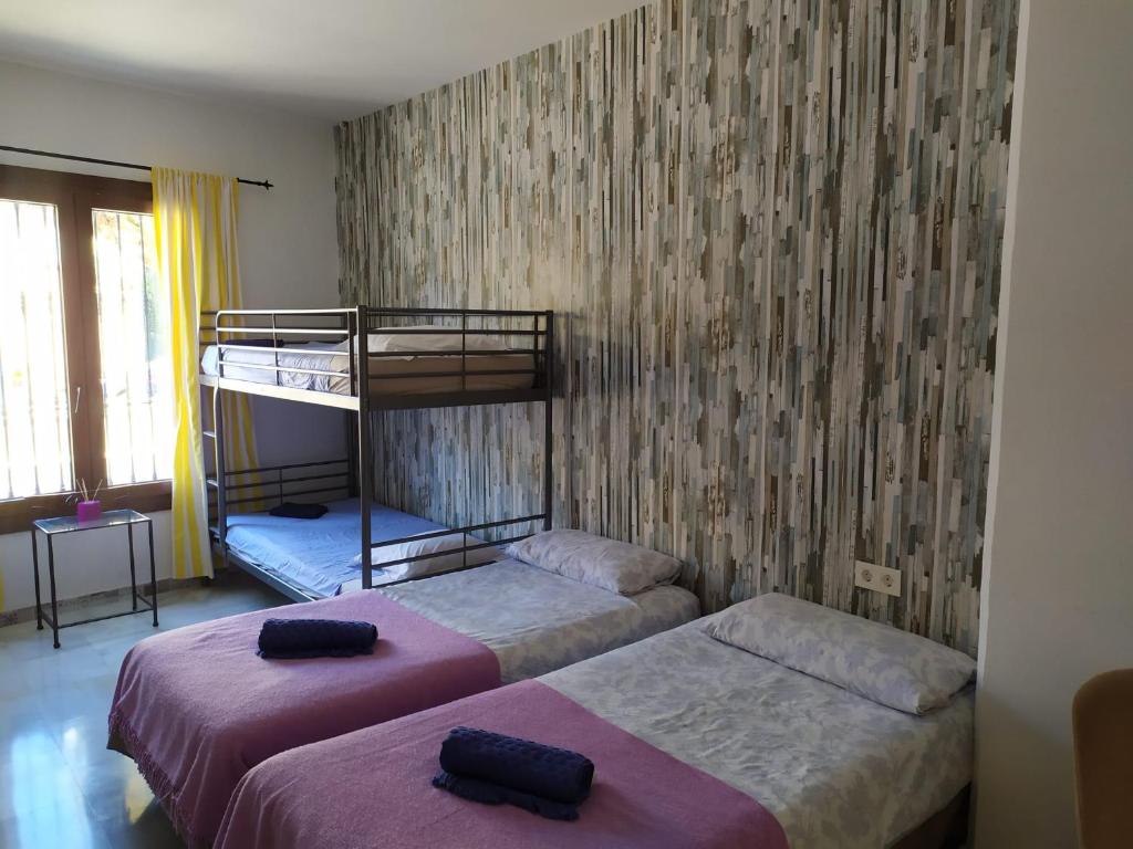 Posteľ alebo postele v izbe v ubytovaní Málaga Centro Hostel