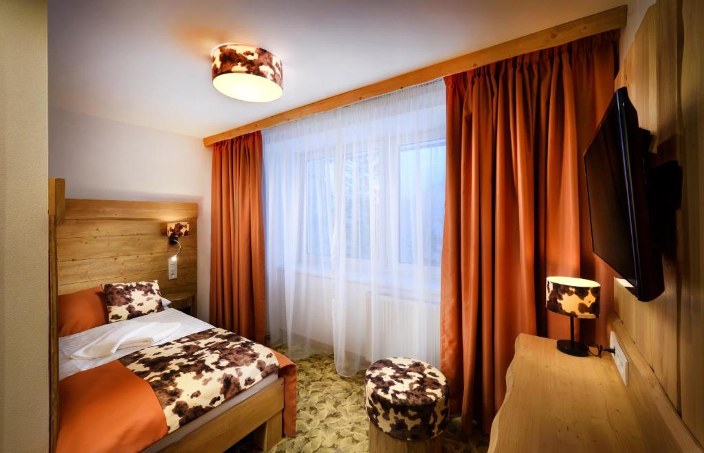 Postel nebo postele na pokoji v ubytování Hotel Srdiečko