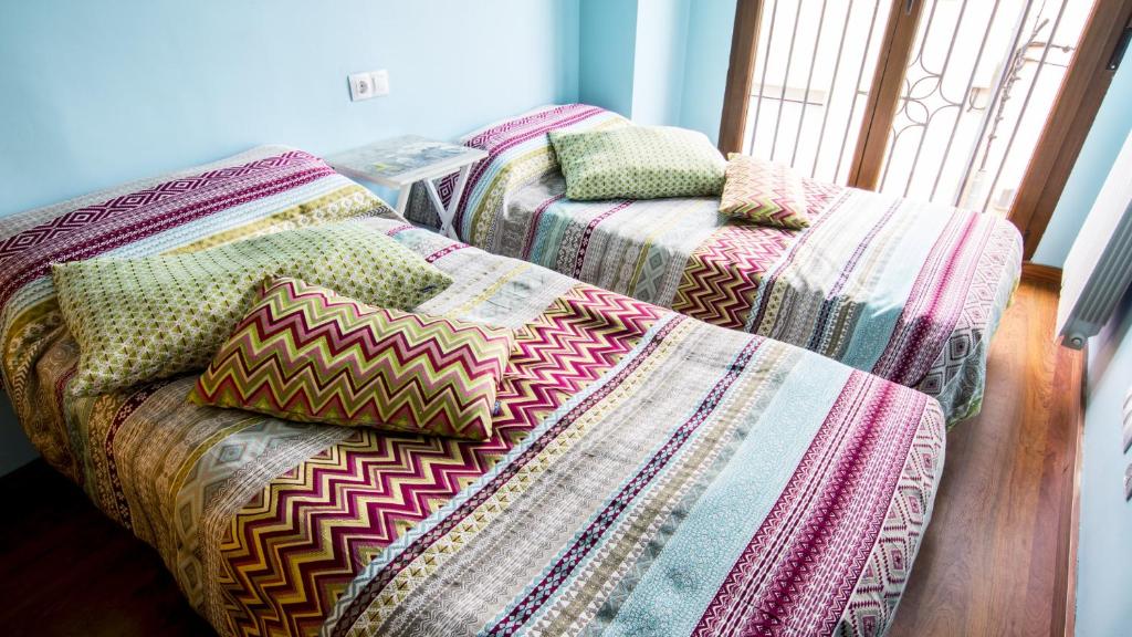 Postel nebo postele na pokoji v ubytování Casa Rural Galana