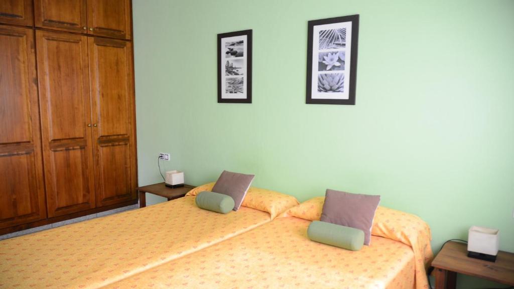 Postel nebo postele na pokoji v ubytování Apt. Passiflora 1B