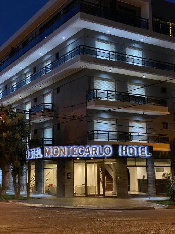 
a large building with a sign on the front of it at Hotel Montecarlo in Mar del Plata

