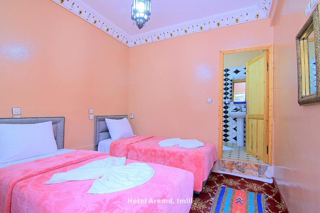 Postel nebo postele na pokoji v ubytování Hotel Igoudar Armed