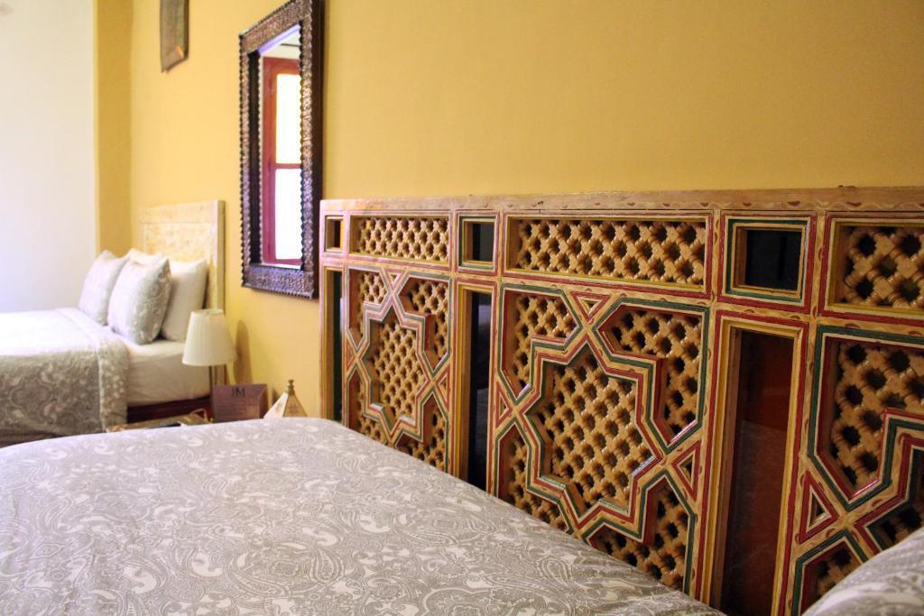 Ліжко або ліжка в номері Riad Meftaha