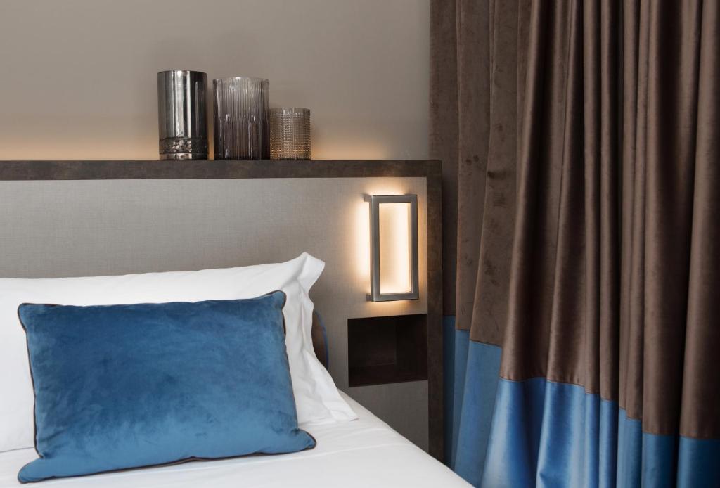 Postel nebo postele na pokoji v ubytování Hotel Continental