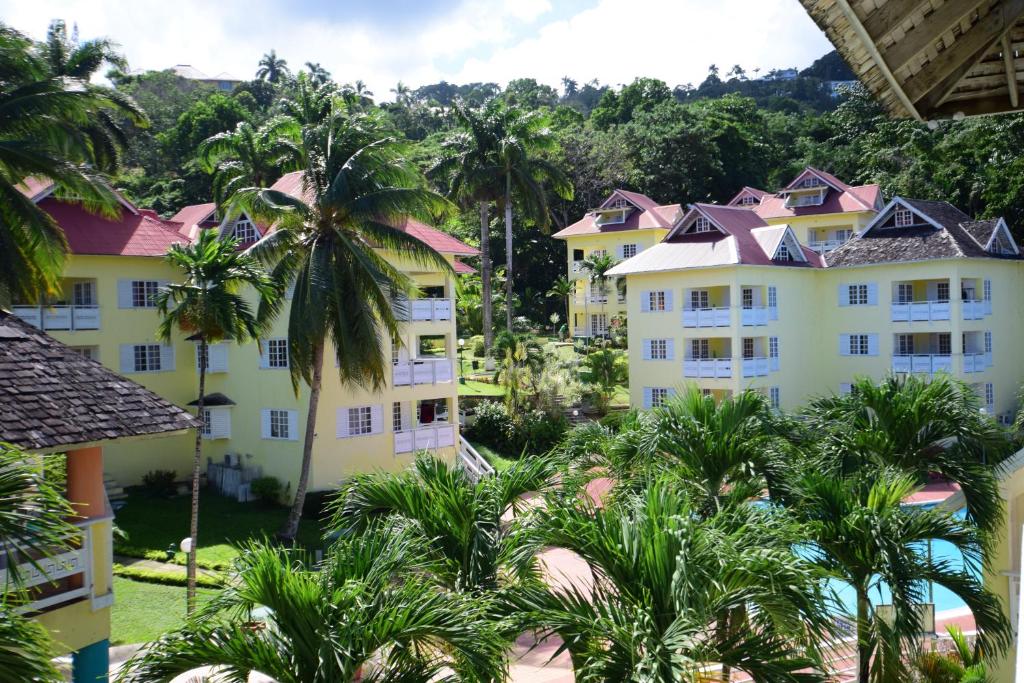 an aerial view of a resort with palm trees at RIVER SIDE Apt 9 @ Mystic Ridge. in Ocho Rios