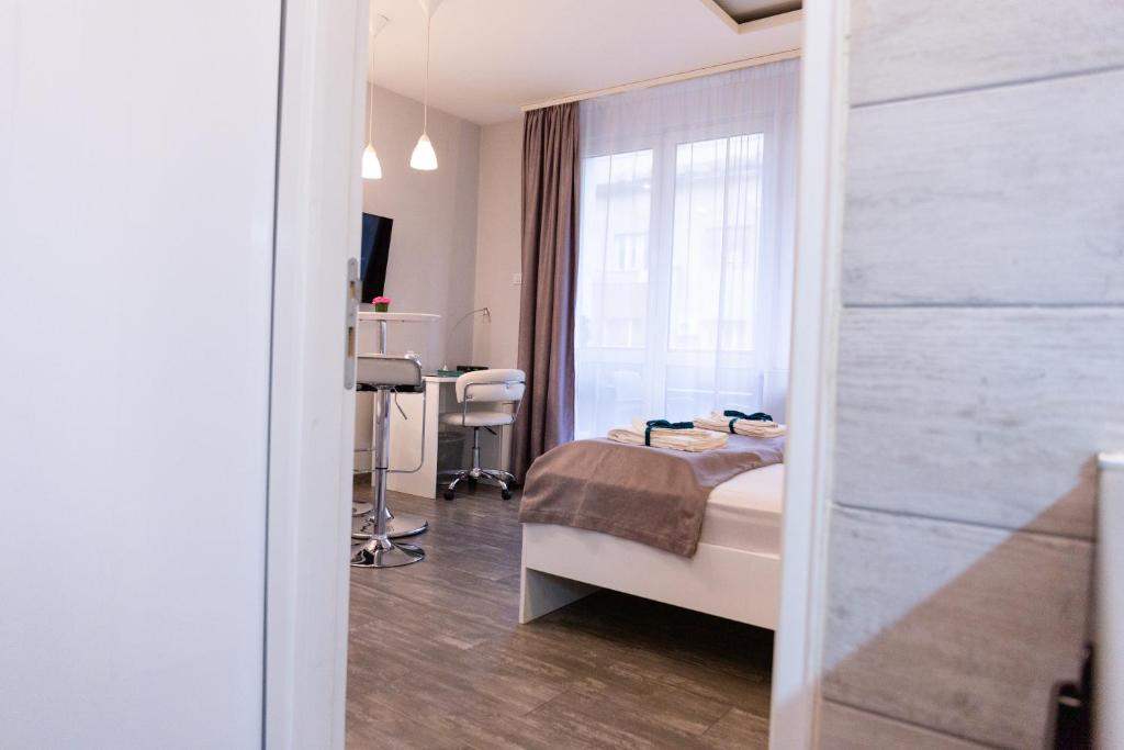 Postel nebo postele na pokoji v ubytování SPA Apartment Nalis