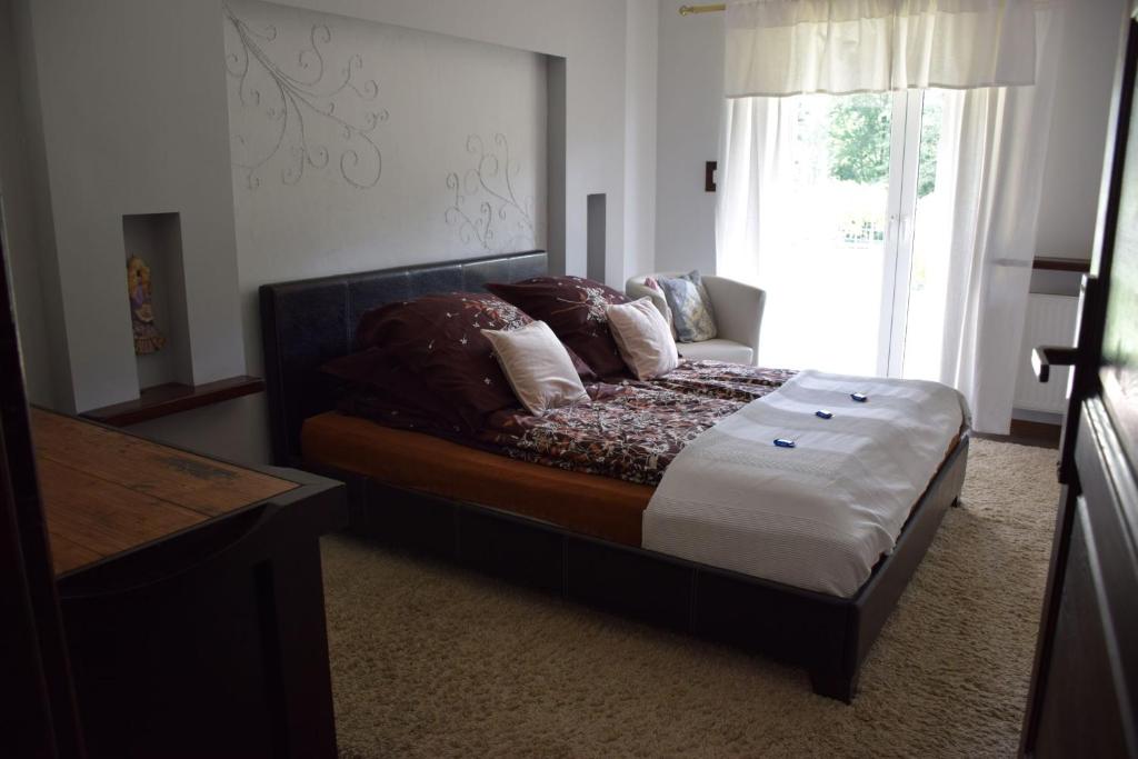 Postel nebo postele na pokoji v ubytování Apartamenty Bukowa Wisła