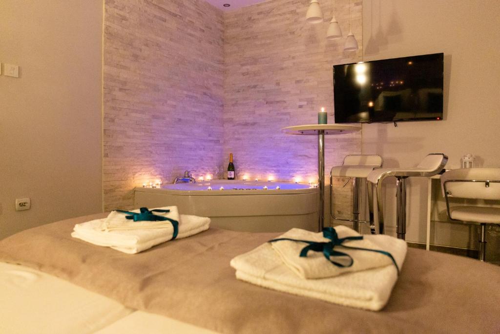 Postel nebo postele na pokoji v ubytování SPA Apartment Nalis
