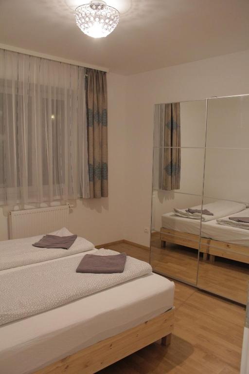 Postel nebo postele na pokoji v ubytování Betariel'com Hauptbahnhof