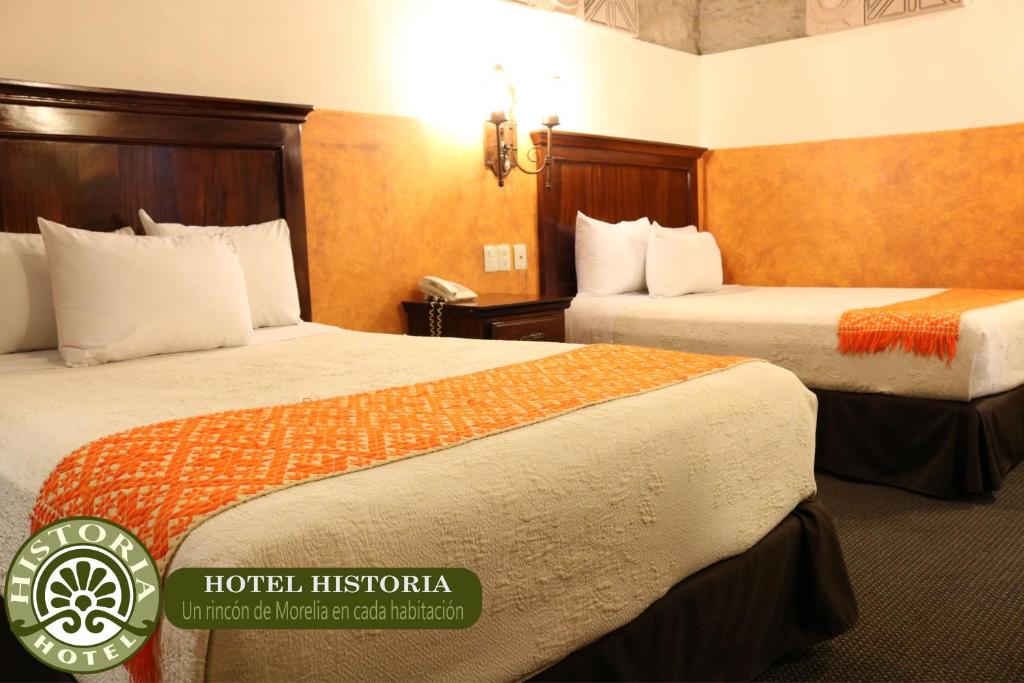 Postel nebo postele na pokoji v ubytování Hotel Historia