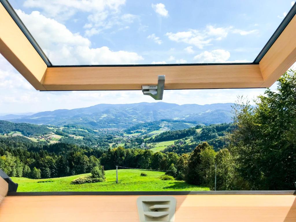 a window in a house with a view of a valley at OSADA WASYLÓWKA in Laskowa