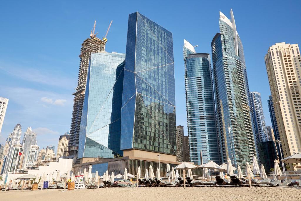 a row of tall buildings on a city street at Sonder at JBR The Walk in Dubai