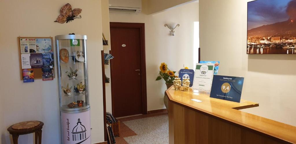 a kitchen with a counter and a refrigerator at RS San Sebastiano Holidays in Acireale