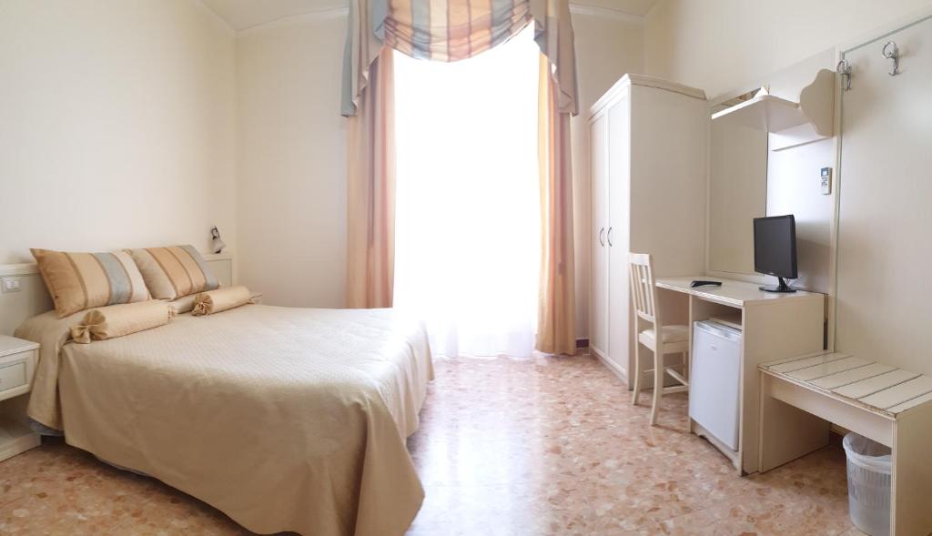 Łóżko lub łóżka w pokoju w obiekcie RS San Sebastiano Holidays