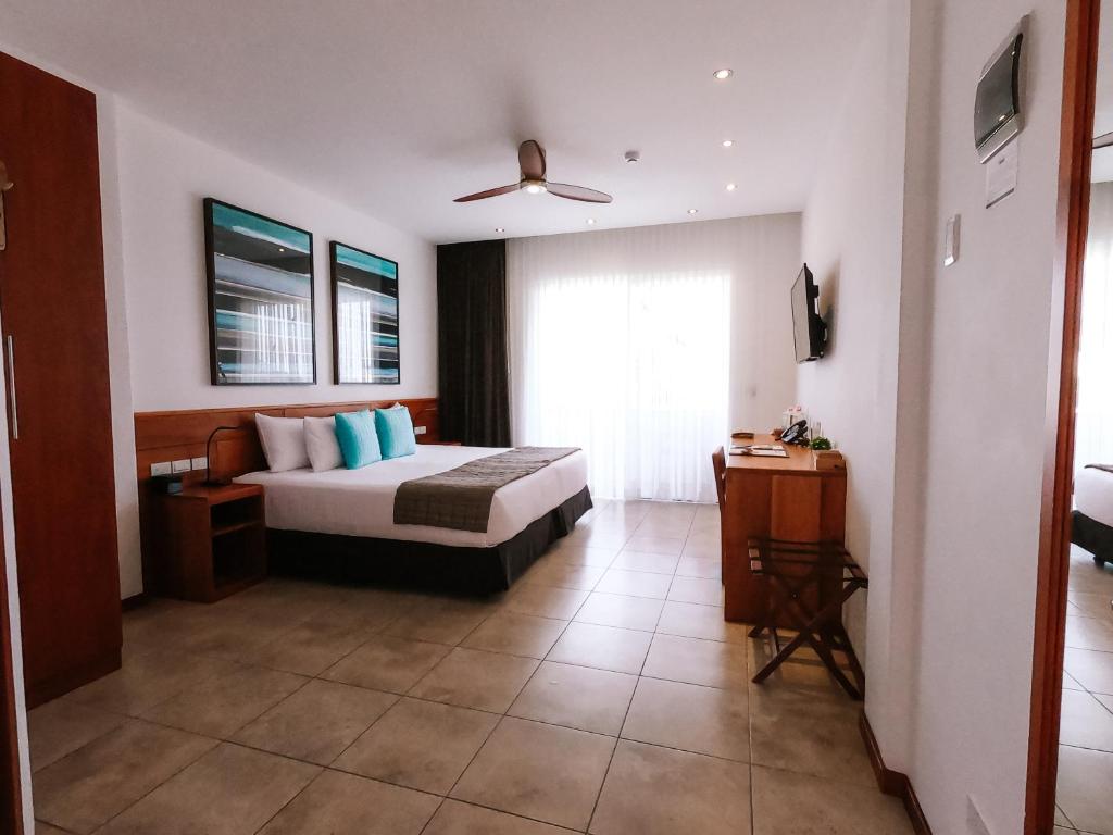 Postel nebo postele na pokoji v ubytování Hotel Cucuve