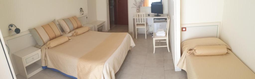 Łóżko lub łóżka w pokoju w obiekcie RS San Sebastiano Holidays