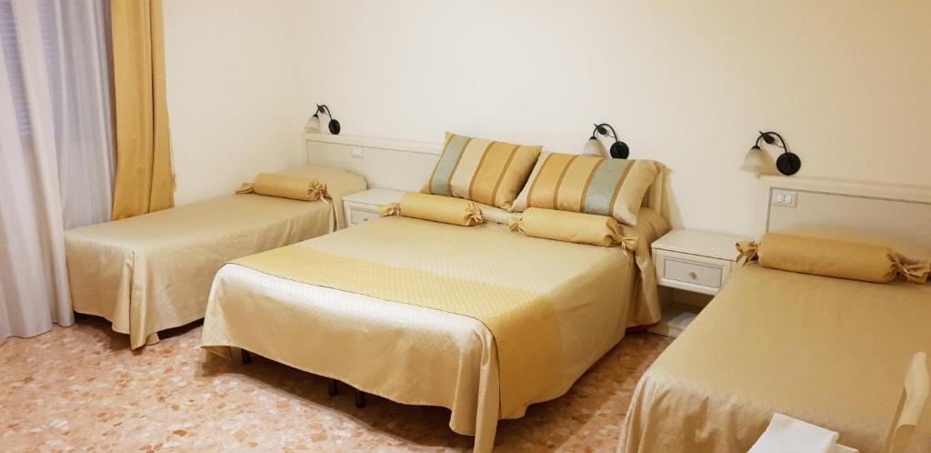 Łóżko lub łóżka w pokoju w obiekcie RS San Sebastiano Holidays