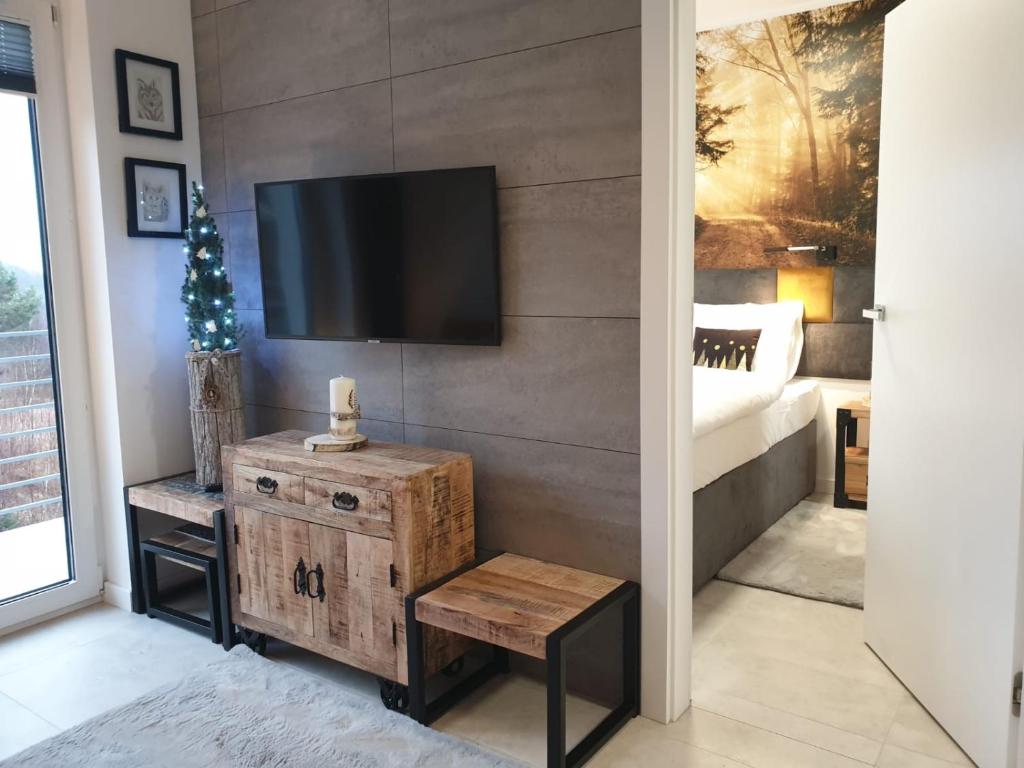 Posteľ alebo postele v izbe v ubytovaní Apartament Zaczarowany Las - 5D Apartamenty