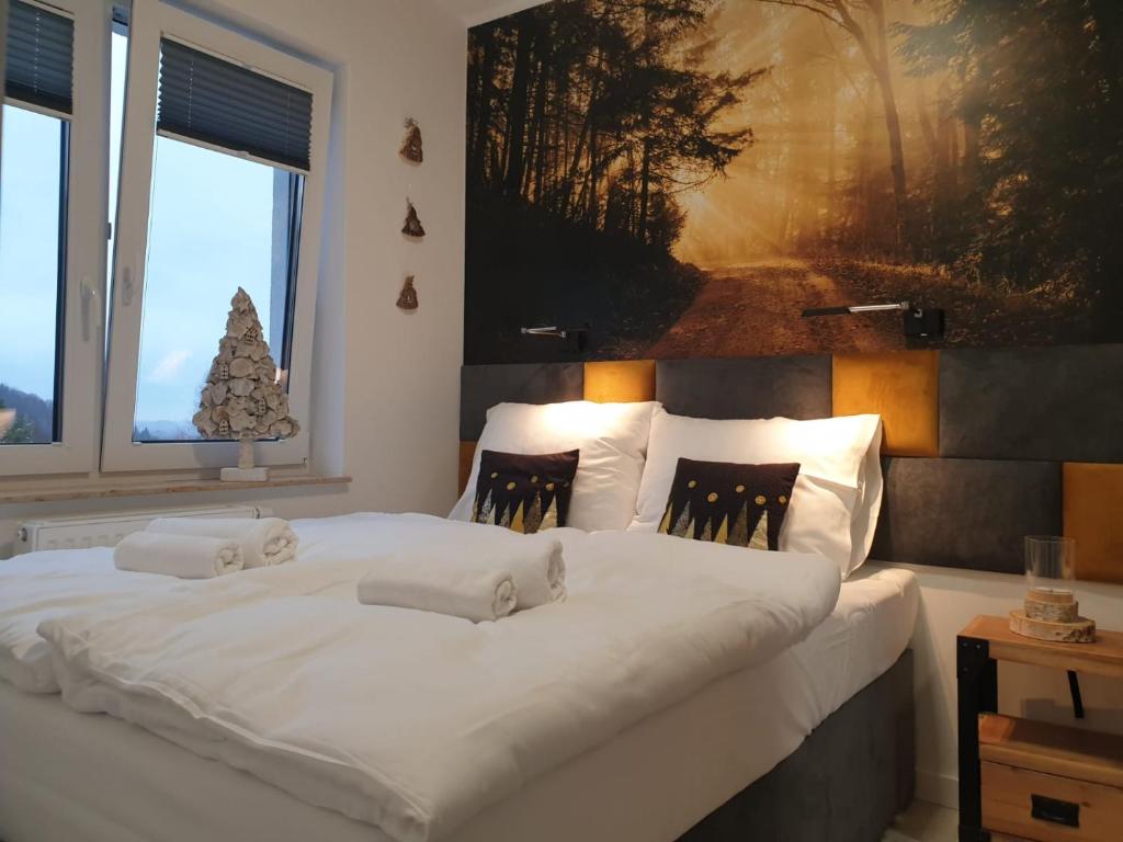 Posteľ alebo postele v izbe v ubytovaní Apartament Zaczarowany Las - 5D Apartamenty