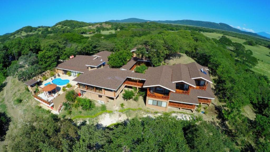 an aerial view of a large house on a hill at Rancho Humo Estancia in Puerto Humo