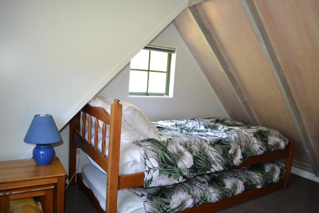 Postel nebo postele na pokoji v ubytování Te Mata Lodge