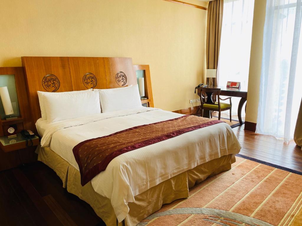 Postel nebo postele na pokoji v ubytování PULSE GRANDE Hotel Putrajaya