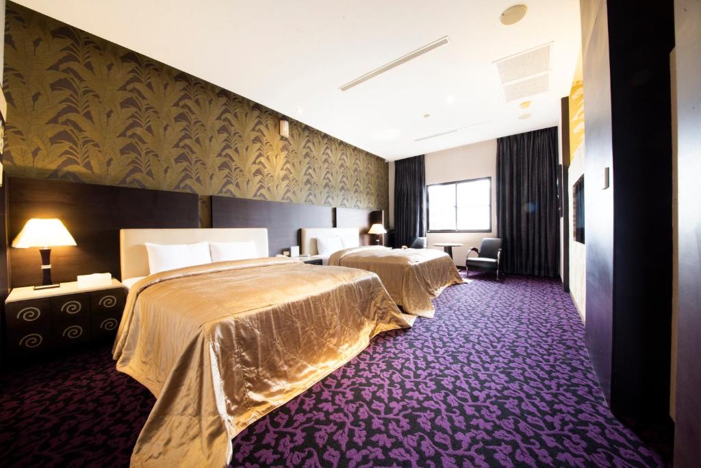 Postel nebo postele na pokoji v ubytování LI-GIN Motel