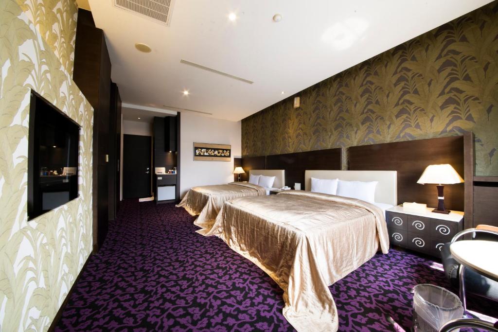 Postel nebo postele na pokoji v ubytování LI-GIN Motel