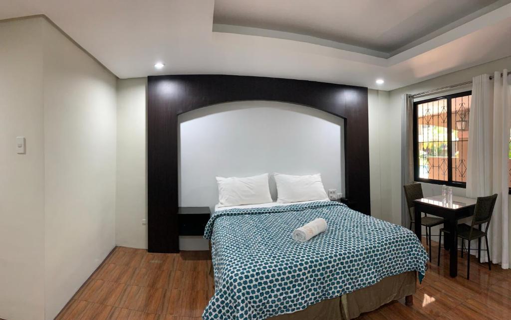 Postel nebo postele na pokoji v ubytování Maharajah Hotel