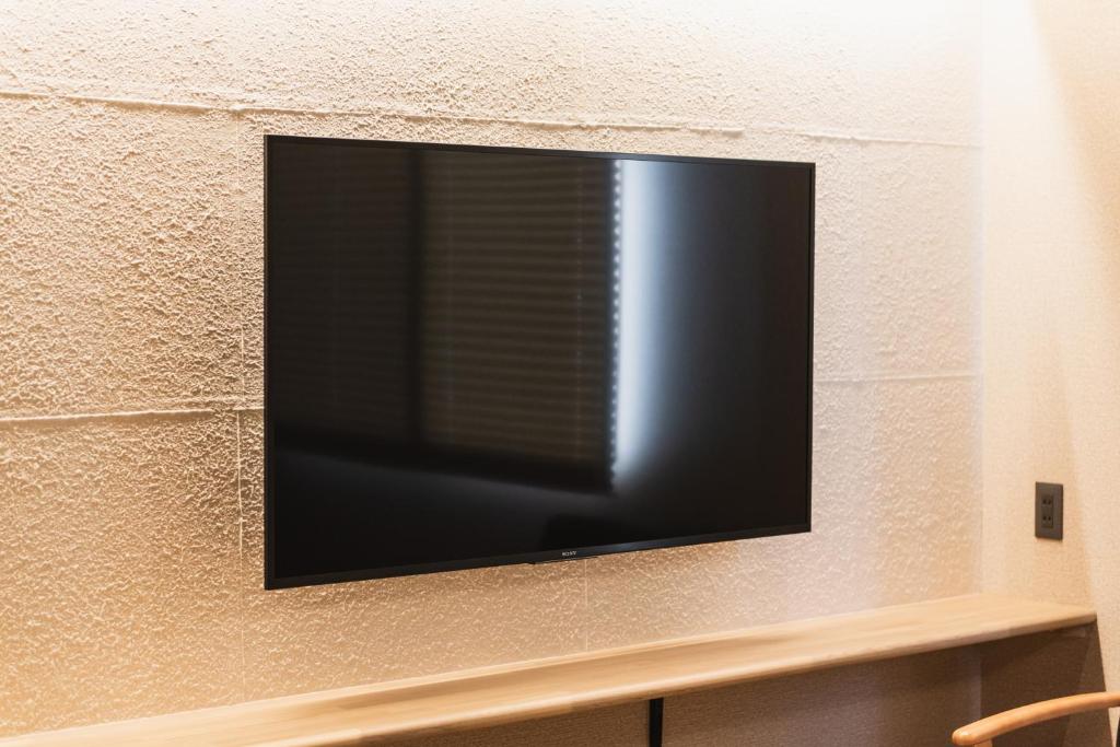 TV a/nebo společenská místnost v ubytování GRAND BASE Beppu Ekihigashi