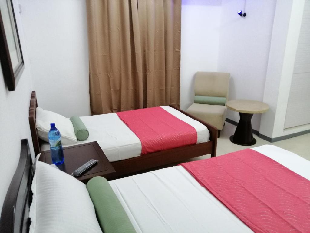 Postel nebo postele na pokoji v ubytování Citronella Villa Flic en Flac