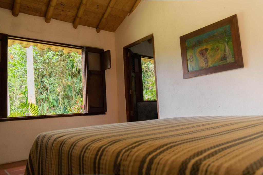 Postel nebo postele na pokoji v ubytování Casa El Cedro